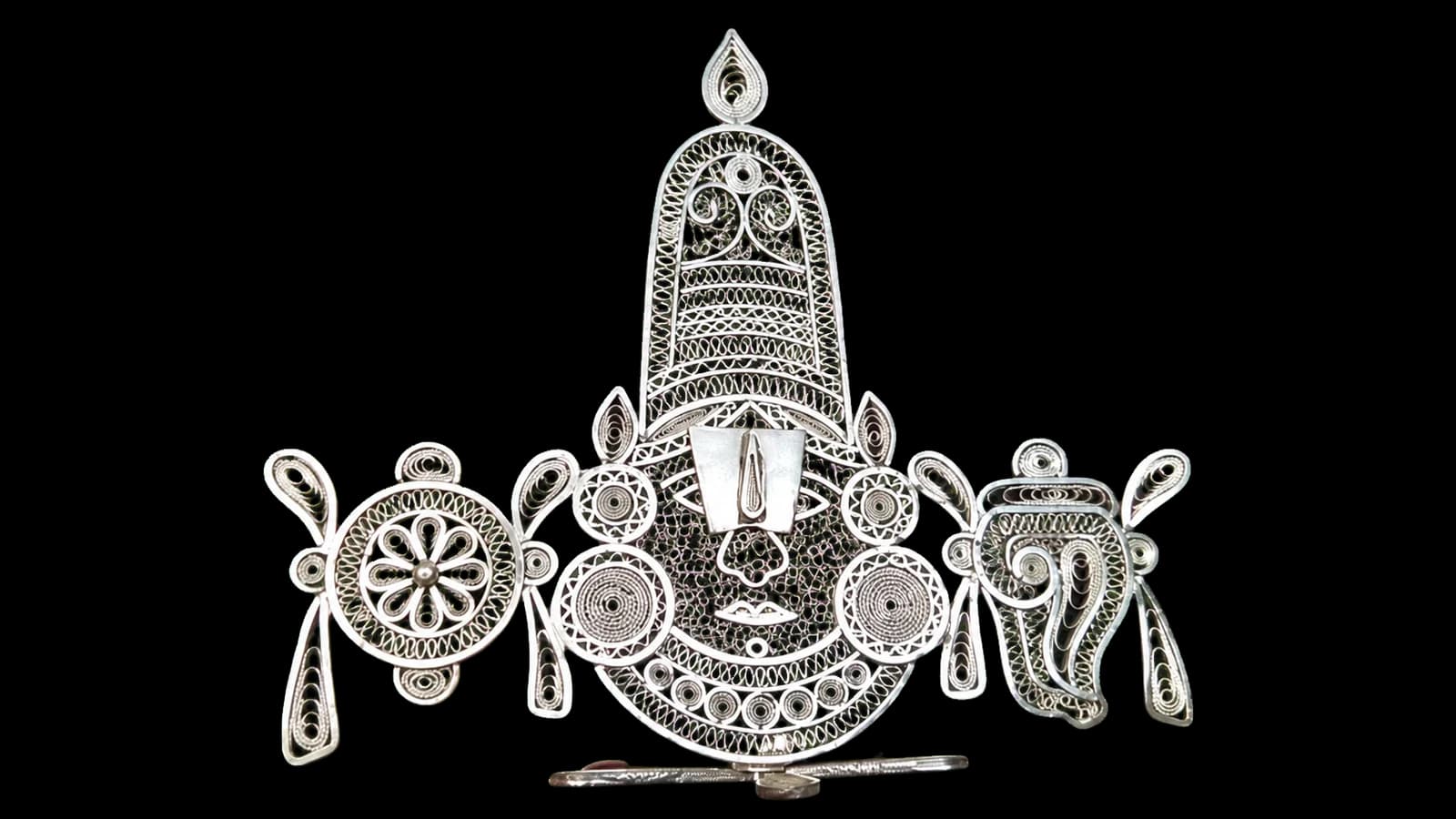 Wide silver filigree temple ornament with a tiered central shrine