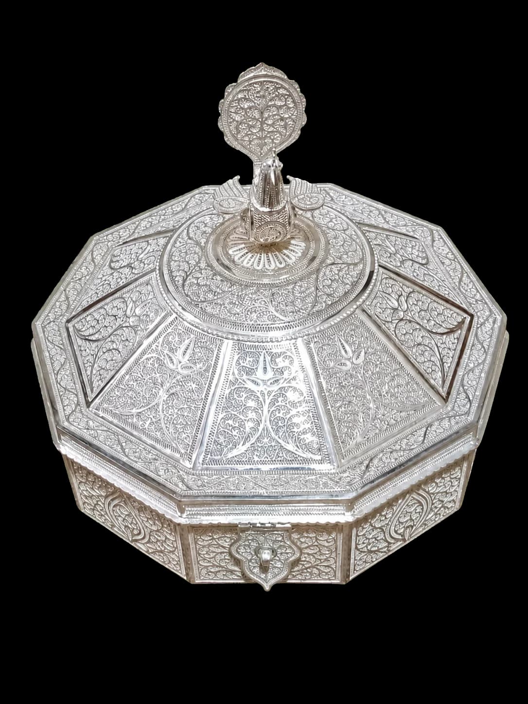 Tall octagonal silver filigree container with a fitted lid